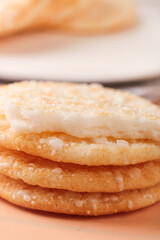 Crispy Rice Crackers Snacks Stacked on Wood Surface - Asian Food Photography