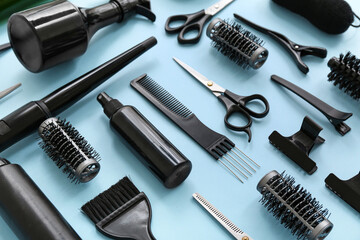 Professional hairdresser's supplies on blue background