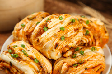 Handmade Pork and Scallion Rolls with Spicy Oil - Traditional Asian Pastry Swirls