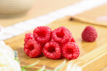 Fresh Red Raspberries on Wooden Board - Ripe Organic Berries Ready to Eat