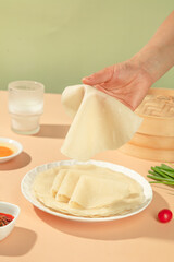 Handmade Dumpling Wrappers Being Prepared in Kitchen with Fresh Ingredients