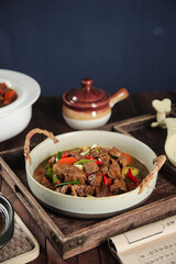 Farmhouse Stewed Duck with Turnip and Vegetables in White Casserole Dish on Rustic Wood Tray