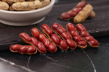 Marinated Spiced Peanuts Traditional Asian Street Food Snack on Dark Slate Surface
