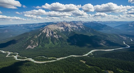 Fototapeta premium Aerial view of majestic mountains river and green forest under blue sky