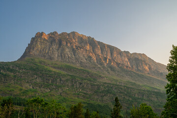 Grinnell Point Rises Over The Swiftcurrent Area Of Glacier