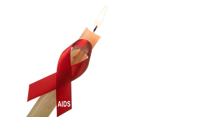 A red ribbon candle symbolizing AIDS awareness. The ribbon is a universal symbol of support and solidarity for people living with HIV/AIDS.