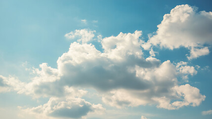 daylight. Fluffy white cloud against blue sky, minimalist nature composition with ample negative space and soft daylight. travel magazines.