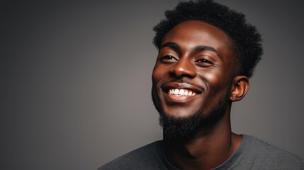 A multicultural individual smiles warmly in a close-up portrait, radiating joy and connection.