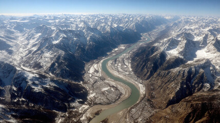 Mountain River Serenity: A majestic river winds its way through a rugged mountain landscape, showcasing nature's enduring beauty and the serene harmony of water and stone. 