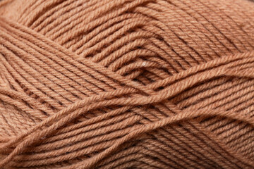 Closeup view of brown knitting yarn as background