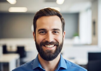 Happy bearded man smiling confidently indoors wearing blue shirt business professional