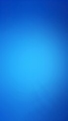 Obraz premium A serene blue background illuminated by soft, warm light cascading from the top, creating a tranquil and inviting atmosphere.
