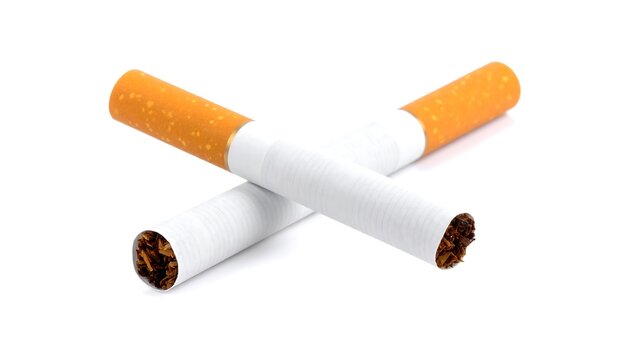 Two crossed tobacco cigarettes, filter tips facing opposite directions, on a clean white background