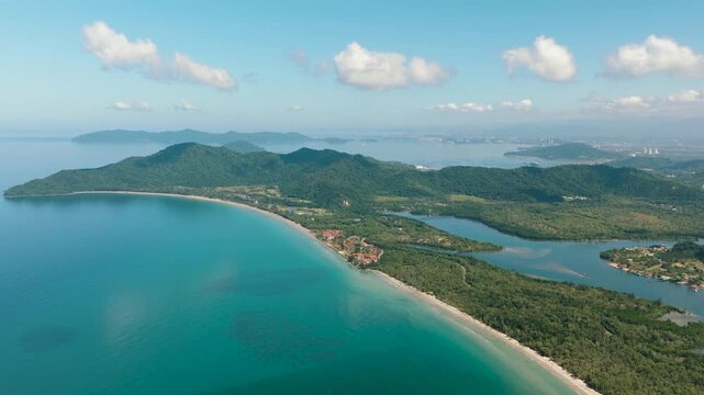 Borneo island coastline with beach and Kota Kinabalu city view. Malaysia.