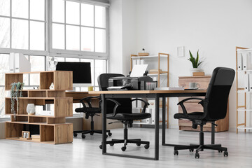 Interior of modern office with printer on table