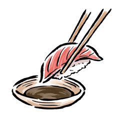 箸でつまんだ寿司と醤油の入った皿