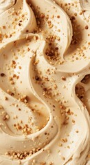 Decadent Swirled Creamy Dessert with Crushed Nut Topping, a Luscious Texture Background