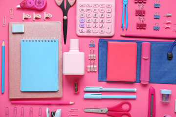 Set of school stationery on pink background