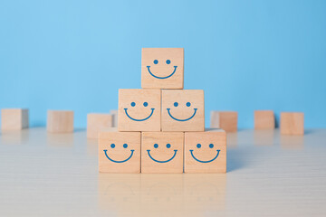 Wooden cube block shape with icon face smiley, The best excellent business services rating customer experience, Satisfaction survey concept