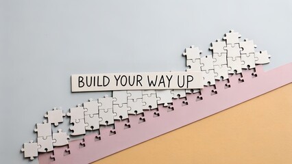 Fototapeta premium A wooden sign showing Build Your Way Up on a puzzle