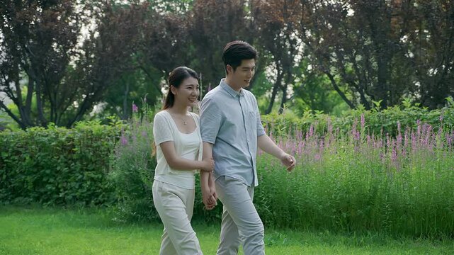 Young couple taking a walk in park