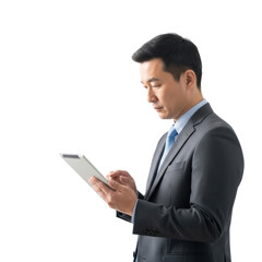 A man in a suit using a tablet computer.