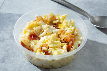 A view of a plastic container of instant breakfast bowl.