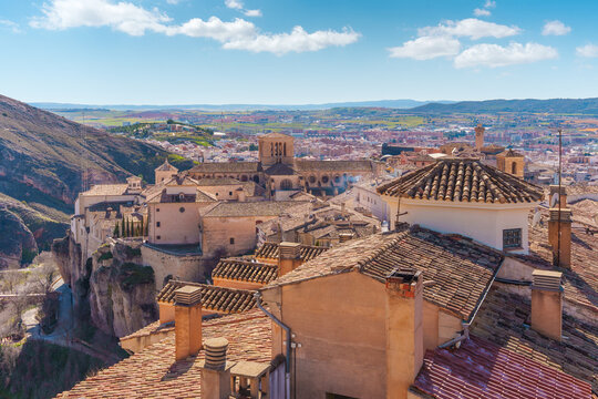 Cuenca cityscape with tiled roofs and cathedral towering over old town in spain