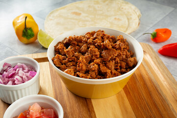 A view of a bowl of chicken chorizo meat.