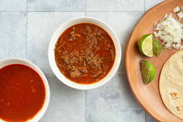 A top down view of a beef birria taco meal.