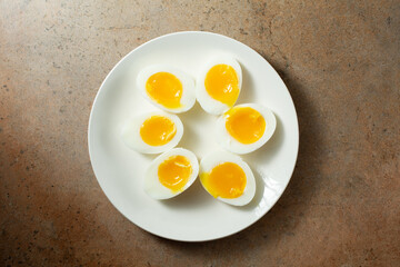 A top down view of halves of 7 minute hard boiled eggs.
