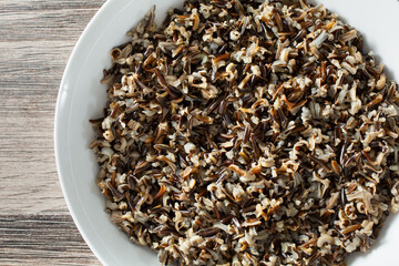 A top down view of a bowl of cooked wild rice.