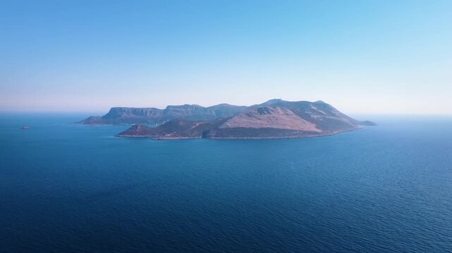 aerial footage capturing the picturesque Meis Island Kastellorizo, a Greek island in the Dodecanese, as seen from the Turkish coastal town of Kas.