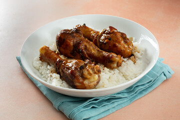 A view of a plate of chicken adobo.