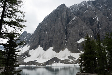 Majestic mountain peak reflecting in serene lake waters