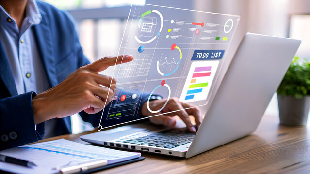 Businessman analyzing project data on transparent screen interface with laptop - Powered by Adobe