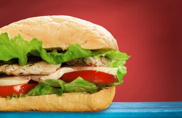 Tasty fresh chicken burger sandwich on desk