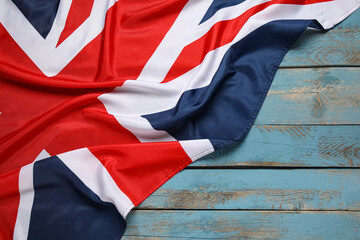 National flag of the United Kingdom on color wooden background