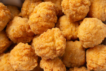 A top down view of a pile of popcorn chicken, as a background.