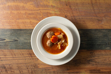 A top down view of a bowl of albondigas.