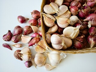 garlic and shallot bulbs on table