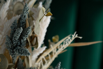 A view of a dry faux plant bouquet, as a background.
