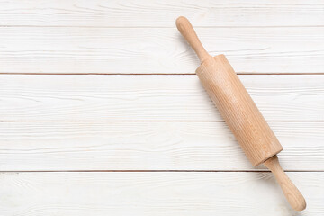 Rolling pin on white wooden background