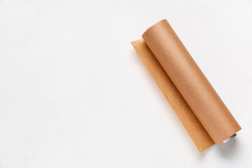 Roll of baking paper on white grunge background
