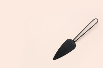 Cake spatula on beige background
