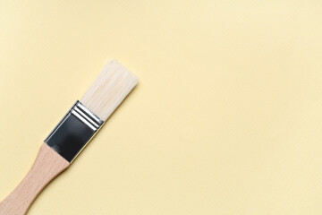 Pastry brush on light yellow background