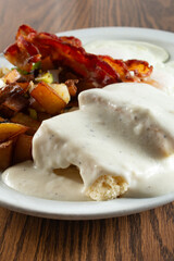 A view of a biscuits and gravy breakfast plate.