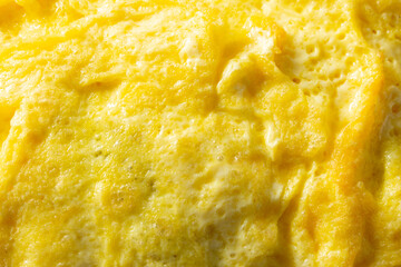 A top down view of an omelet, as a background.