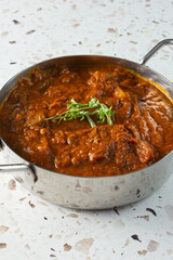 A view of a bowl of lamb vindaloo.