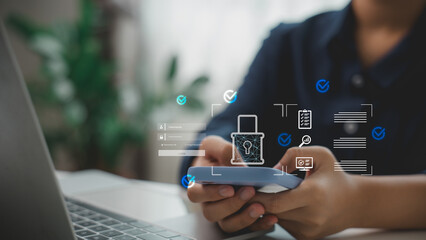 User holding smartphone with cybersecurity login interface, data protection icons, and secure...